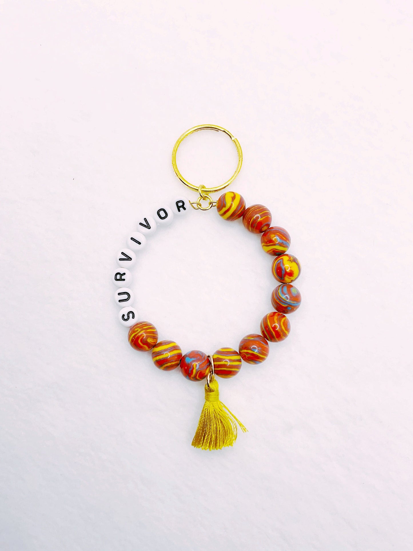 Zuri and Zyla Keychain Survivor in Marble